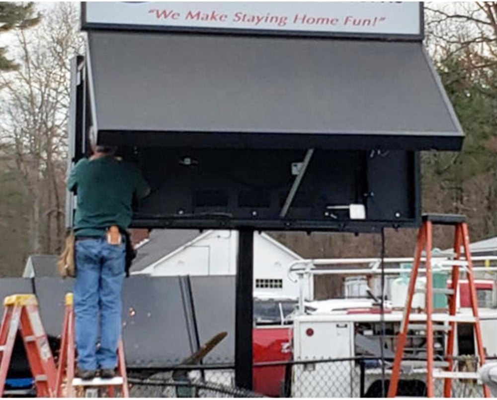 Outdoor display board installation access showing structure, service space, and site condition
