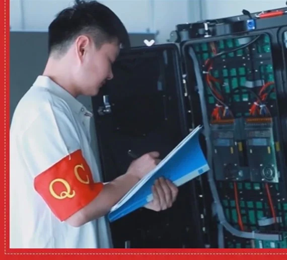 Technician inspecting the internal components of an LED display cabinet